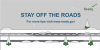 A snow covered plowed road. Stay off the roads. for more tips visit www.ready.gov.